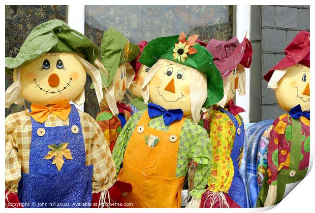 Homemade Scarecrows for sale outside a shop at Porthmadog in Wales.  Print by john hill