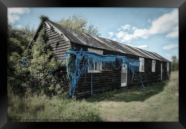 WWII abandoned barrack hut on the shore of the River Blackwater at Bradwell, Essex Framed Print by Peter Bolton