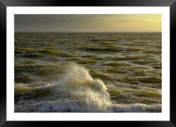 A single breaking wave caught in the fading light of a sunset At The Garrison, Shoeburyness, Essex, UK. Framed Mounted Print by Peter Bolton