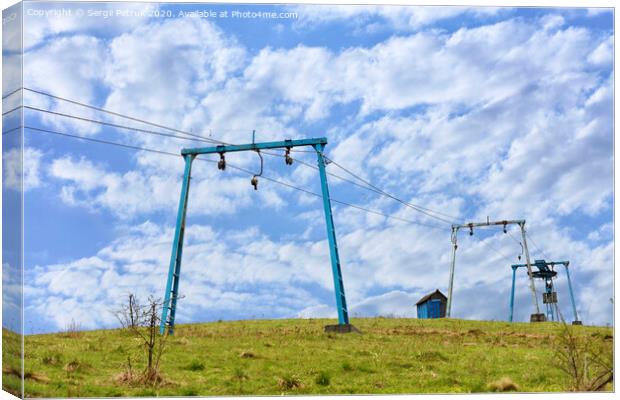 The framework of the mountain cable lift stand alone on the top of the mountain. Canvas Print by Sergii Petruk