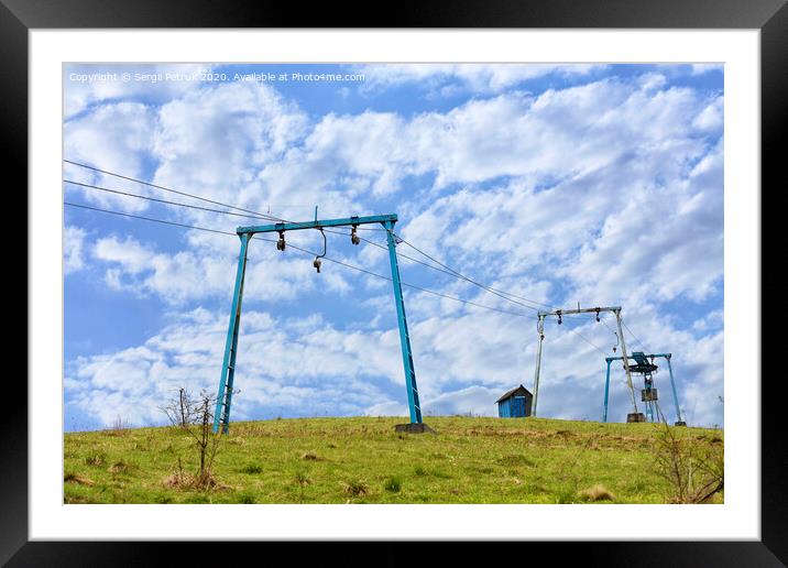 The framework of the mountain cable lift stand alone on the top of the mountain. Framed Mounted Print by Sergii Petruk