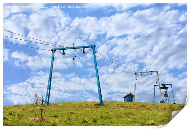The framework of the mountain cable lift stand alone on the top of the mountain. Print by Sergii Petruk