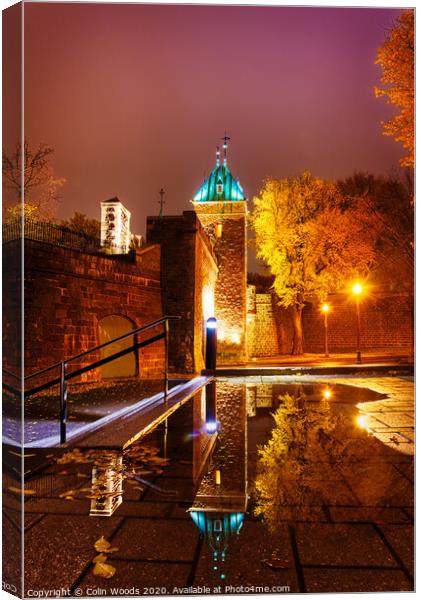The Porte St Louis, Quebec City, at night reflected in a puddle of water Canvas Print by Colin Woods