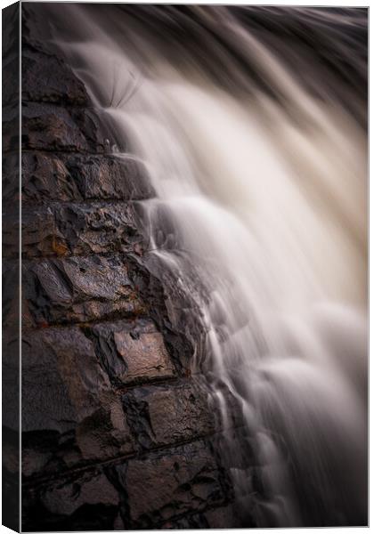 Flowing water Canvas Print by Dean Merry