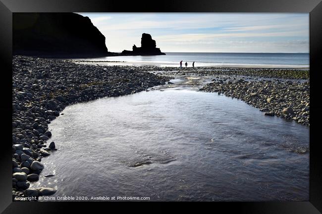 Beach combing at Talisker Bay Framed Print by Chris Drabble