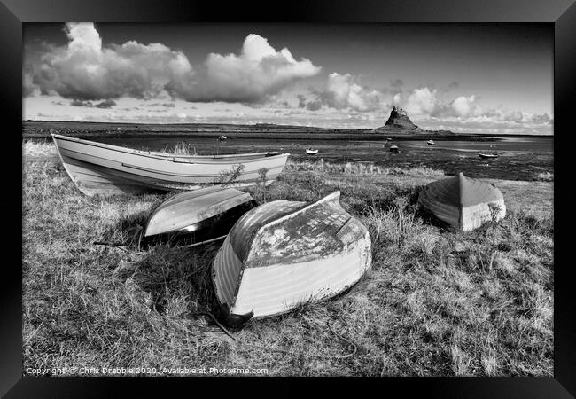 Boats at Lindisfarne in mono Framed Print by Chris Drabble