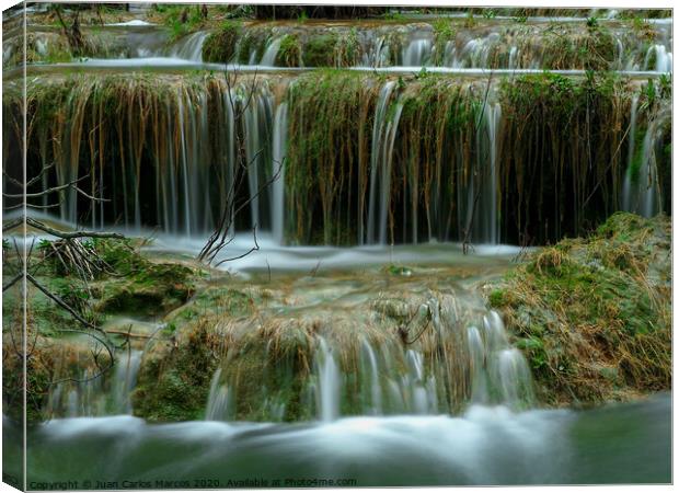 Natural water ladder in the river Canvas Print by Juan Carlos Marcos