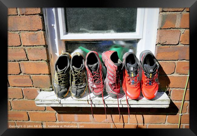 Washed trainers left to dry in the sunshine. Framed Print by john hill