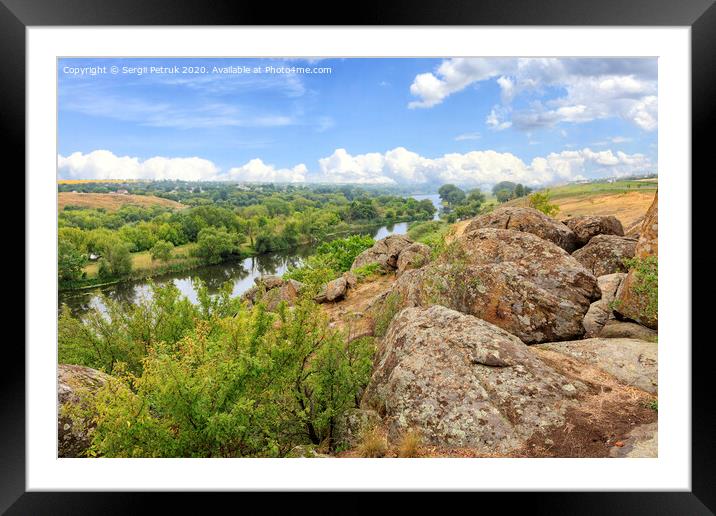 Large stone boulders rise above the river on the shore of the Southern Bug. Framed Mounted Print by Sergii Petruk