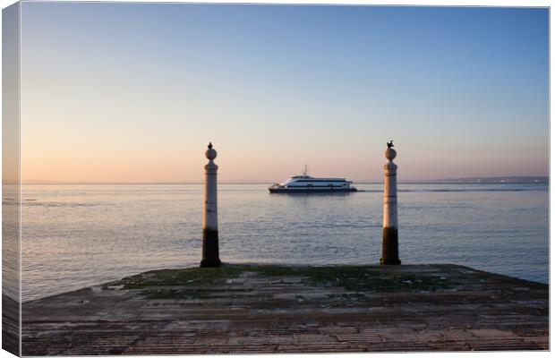 Columns Pier and Tagus River at Sunrise in Lisbon Canvas Print by Artur Bogacki