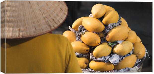 Mangoes at Market in Vietnam Canvas Print by David Bokuchava