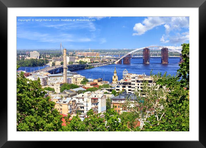 The landscape of the summer city of Kyiv with a view of the Dnipro River, many bridges and the old Podol district. Framed Mounted Print by Sergii Petruk