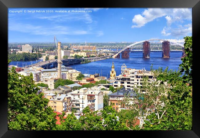 The landscape of the summer city of Kyiv with a view of the Dnipro River, many bridges and the old Podol district. Framed Print by Sergii Petruk