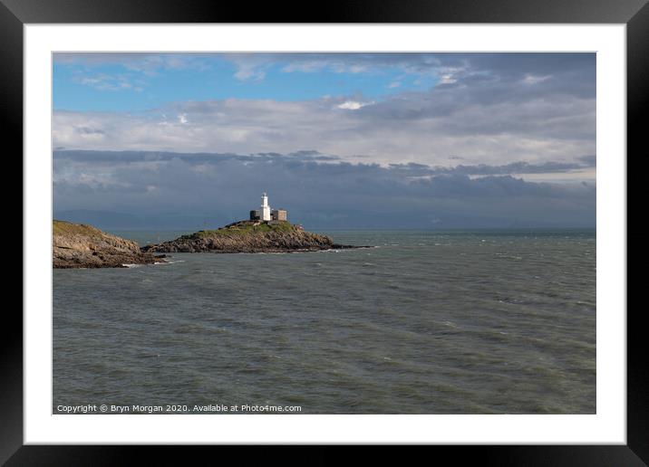 Mumbles lighthouse viewed from Bracelet bay Framed Mounted Print by Bryn Morgan