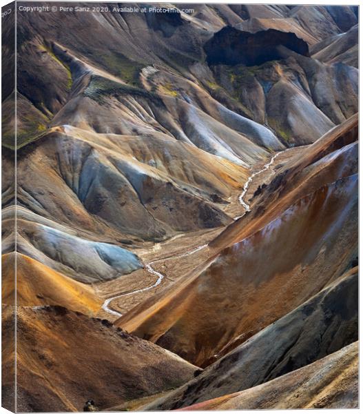 River along a Valley in Landmannalaugar among colorful mountains, Iceland Canvas Print by Pere Sanz