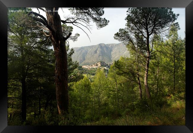 Guadalest, Spain seen from a the surrounding forest  Framed Print by Navin Mistry