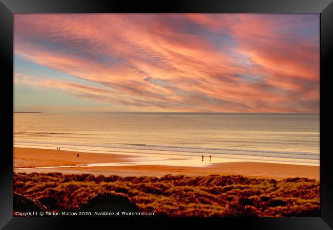 Sunset overlooking Bamburgh Beach Framed Print by Simon Marlow