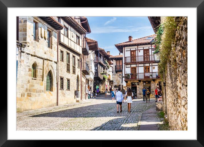Tourists walking around the town in Santillana, Sp Framed Mounted Print by Kevin Hellon