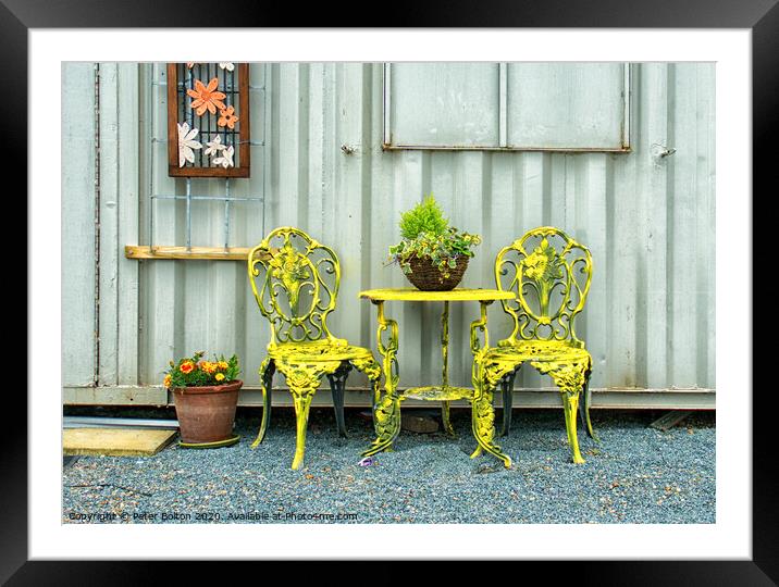 'Rest a while'. Ornamental table and chairs outside an artists studio at the marina at Old Leigh Essex, UK. Framed Mounted Print by Peter Bolton