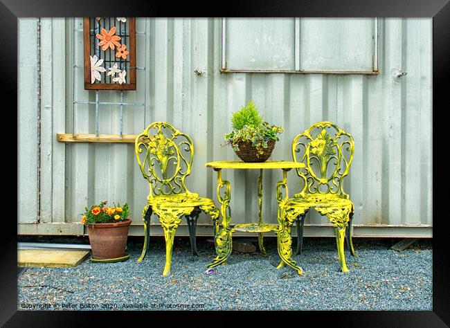'Rest a while'. Ornamental table and chairs outside an artists studio at the marina at Old Leigh Essex, UK. Framed Print by Peter Bolton