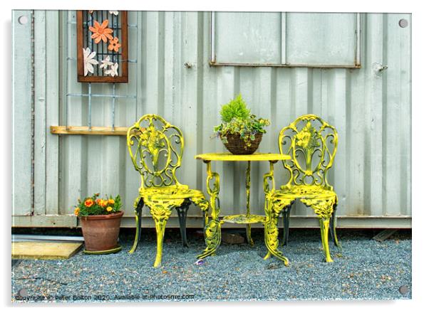'Rest a while'. Ornamental table and chairs outside an artists studio at the marina at Old Leigh Essex, UK. Acrylic by Peter Bolton