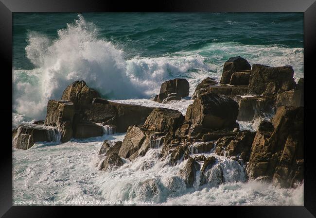Waves crash against the rocks at Lands End, Cornwa Framed Print by Michael Shannon