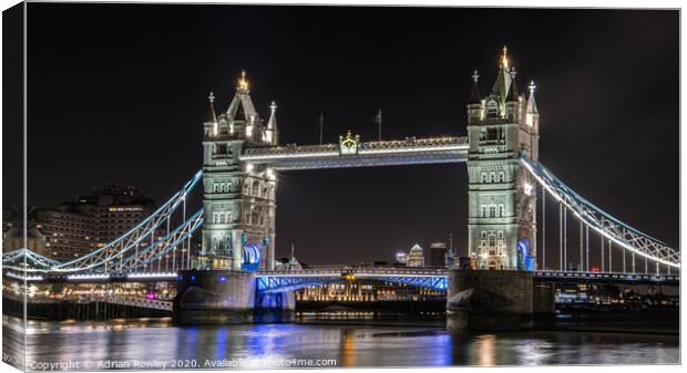 Tower Bridge at Night - London, United Kingdom.  Canvas Print by Adrian Rowley