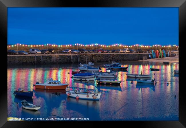 Mousehole Harbour at night Framed Print by Simon Maycock