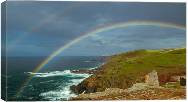 Rainbow over Pendeen lighthouse Canvas Print by David Belcher
