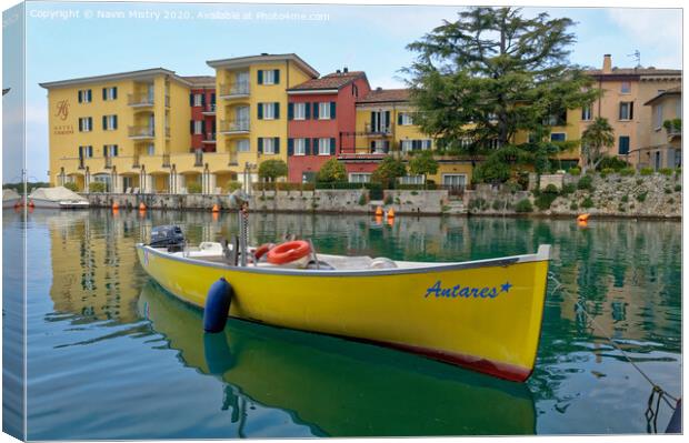  A small boat moored in the harbour of Sirmione, Lake Garda, Italy Canvas Print by Navin Mistry