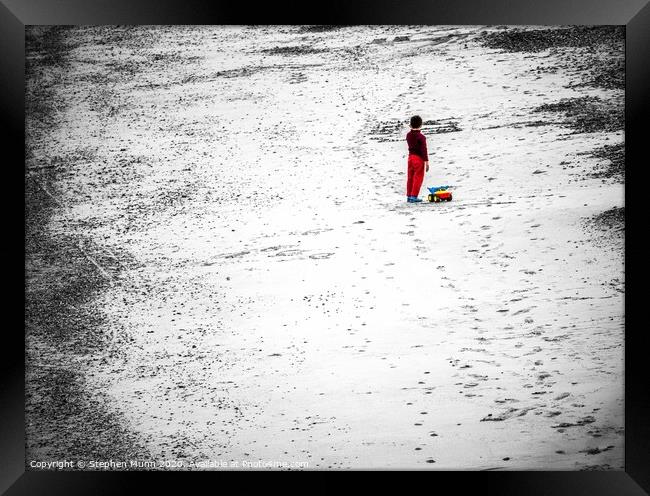 Boy on the beach Framed Print by Stephen Munn