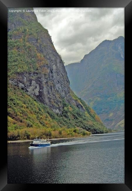 Boat in Norwegian Fjord Framed Print by Laurence Tobin