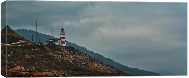 Majestic Silleiro Lighthouse Stands Tall Amidst Mo Canvas Print by Jesus Martínez