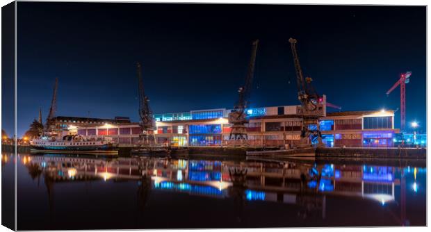 Bristol M Shed cranes reflections  Canvas Print by Dean Merry