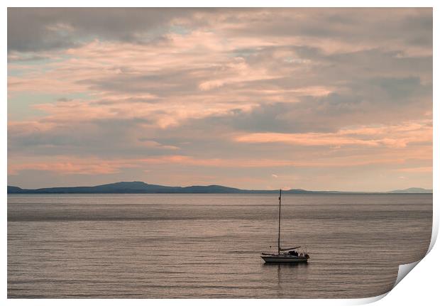 Sailboat moored off the coast at Aberffraw. Print by Colin Allen