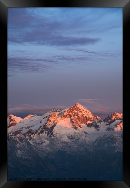 Sunrise in the Alps Framed Print by John Hughes