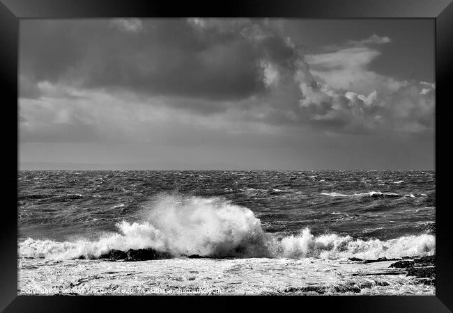Waves crashing against the rocks Framed Print by Gordon Maclaren