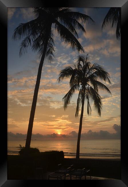 Tropical sunrise seascape with Palm trees at Huay Yang , Thailand. Framed Print by Geoff Childs