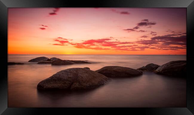 Sunrise over the rocks Framed Print by Arpad Radoczy