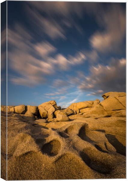 Long exposure clouds over the interesting shape rock Canvas Print by Arpad Radoczy