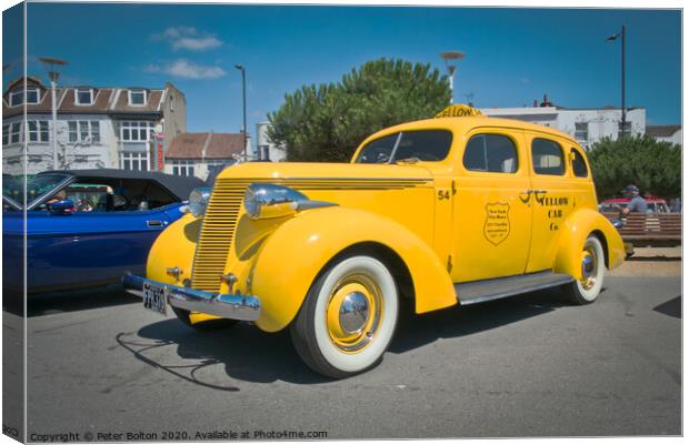 'Big Yellow Taxi' on display at Southend on Sea, Essex, UK. Vintage vehicle at a show. Canvas Print by Peter Bolton