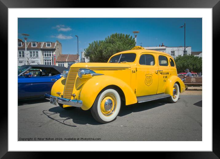 'Big Yellow Taxi' on display at Southend on Sea, Essex, UK. Vintage vehicle at a show. Framed Mounted Print by Peter Bolton