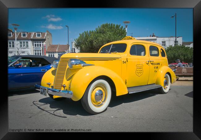 'Big Yellow Taxi' on display at Southend on Sea, Essex, UK. Vintage vehicle at a show. Framed Print by Peter Bolton