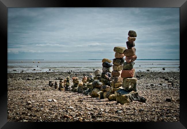 'Land art' on East Beach, Shoeburyness, Essex, UK. made from found stones, and rocks. Remains of historic victorian military buildings on the shoreline. Framed Print by Peter Bolton