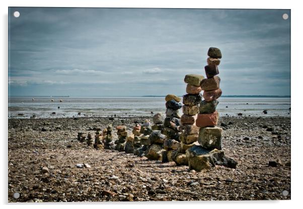 'Land art' on East Beach, Shoeburyness, Essex, UK. made from found stones, and rocks. Remains of historic victorian military buildings on the shoreline. Acrylic by Peter Bolton