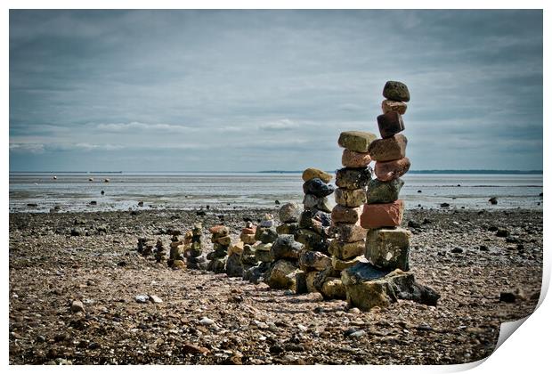 'Land art' on East Beach, Shoeburyness, Essex, UK. made from found stones, and rocks. Remains of historic victorian military buildings on the shoreline. Print by Peter Bolton