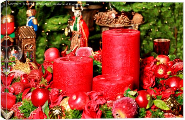 Three thick red candles surrounded by Christmas decorations and fairytale figures. Canvas Print by Sergii Petruk