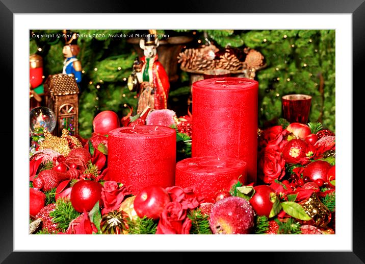 Three thick red candles surrounded by Christmas decorations and fairytale figures. Framed Mounted Print by Sergii Petruk