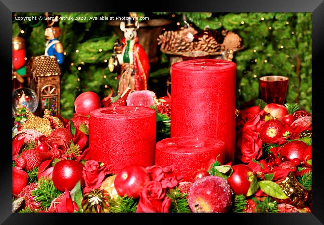 Three thick red candles surrounded by Christmas decorations and fairytale figures. Framed Print by Sergii Petruk