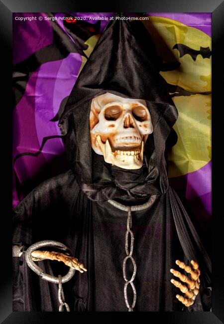 Halloween, death doll in a black hoodie with metal chains and shackles on his hands. Framed Print by Sergii Petruk